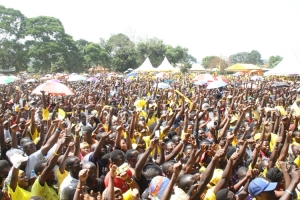 Hundreds of supporters raising high the NRM Party symbol.