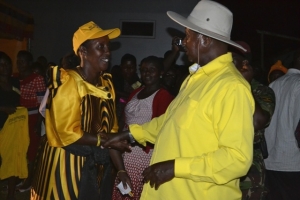 Rose Tumusiime rubbing shoulders with Museveni at a past campaign rally in Entebbe 