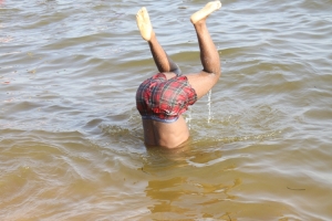 Rowdy fella pulling crazy stunts in lake.