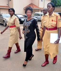 Female Prison warders lead Bad Black to jail.