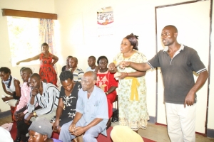 Frustrated former GSL employees pinning down Ssali Martin in RDC Rose Kirabira's office on Thursday.