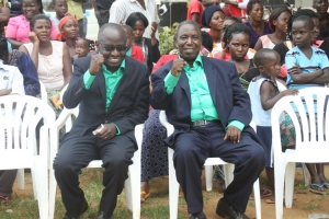 Gerald Wilson Mukasa (R) with NBS' Simon Kaggwa Njala at a campaign rally.