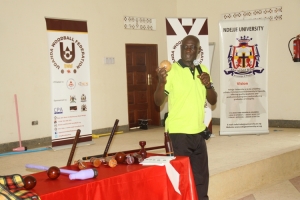 Wood ball International Referee George Isabirye takes the participants through the different woodball rules.