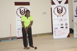 Wood ball's Shanaz demonstrates how to swing while playing wood ball.