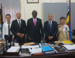Chinese Heima Investors pose for a group photo with Minister Ssempijja.