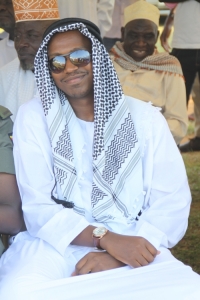 Fabrice Rulinda dressed like oil sheikh.
