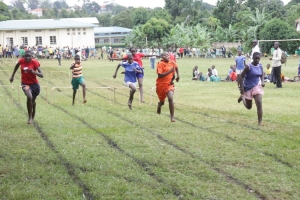 Girls participate in a 100m hurdles race.