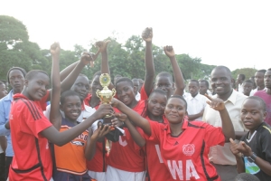 Kennedy High School smiling with trophy after being crowned Champions.