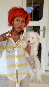 Maggie V with her pet. She is hooked to a loaded Zungu dude. 