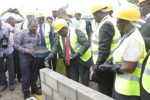 Minister John Byabagambi ground breaking. He cautioned the contractors against shoddy work.