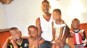 Omara Benson looking stranded with his kids.