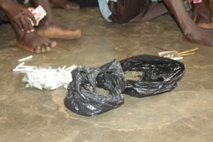 Opium in polythene bags plus sticks.