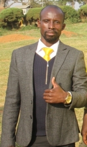 Entebbe Airport clearing officer Edward Mugyeni grassing like chicken. 