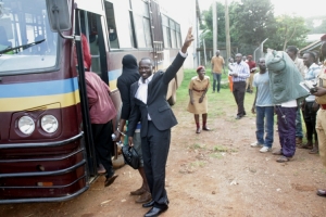 Giita Alex flashes FDC Victory sign as he boards the prisons Bus to Kigo Cells.
