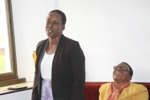 Hon. Tumusiime smiling sweet during the final council meeting on Monday.