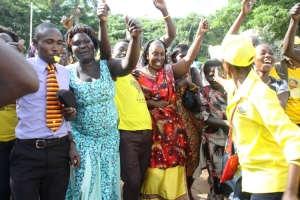 Hon. Tumusiime supporters mob her after being sworn in.