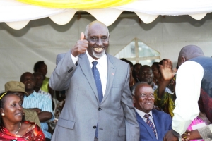 Hon.Tumusiime's dad Mzee Bikaako Robert smiling from the bottom of his heart.