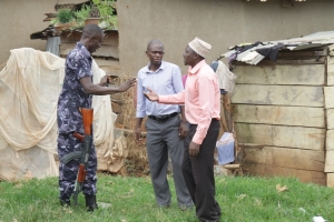 Kitooro Central LCIII Councilor Bruhan Rubogo (right) exchanging with police.