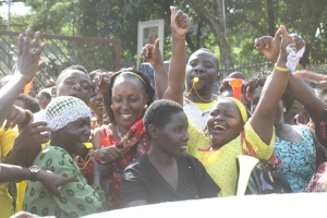 Rose Tumusiime's supporters mob her like bees shortly after being sworn in.