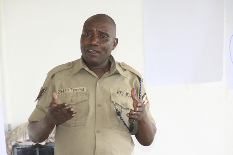 Police Trains 50 Residents In Community Based Arbitration Skills. Sgt. Johnson Tenywa explaining community based Abitration skills to the participants.