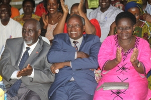 from left. Mzee Bikaako Robert, Uncle Kahirita and Rose Tumusiime's sister smiling from ear to ear.
