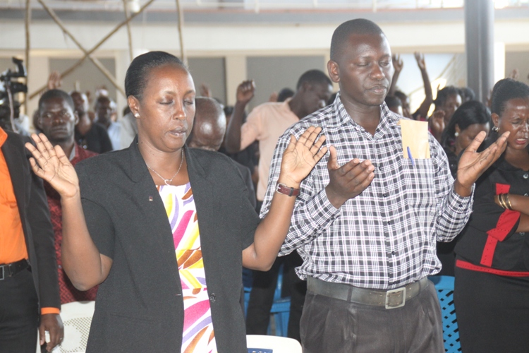 MP Tumusiime’s Journey One Year Down The Road. Hon. Rose Tumusiime and her personal assistant George Ntonganyi during a Church service at Pastor Aaron Mutebi's Church.