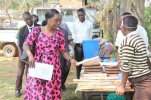 Hon. Tumusiime admiring some of items made by the pupils.