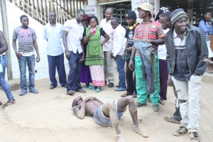 Locals surrounding Sembooze like bees at Abaita Ababiri police Post.