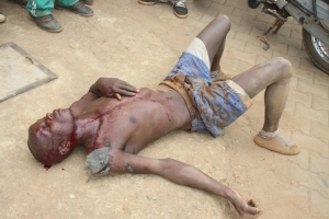Sembooze Geoffrey Kyewalyanga oozing blood at  Abaita Ababiri police post.