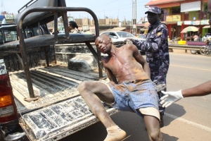 Sembooze boarding police pick up truck.