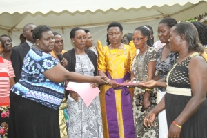 RDC Kirabira, Hon. Tumusiime and Hon. Seninde hand over project files to the success groups.