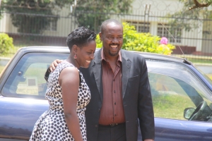 Tycoon Henry Kakuuyo with a soupy babe.