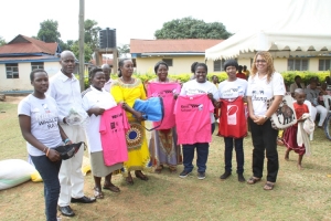 Hon. Tumusiime and the Tag rugby association pose for a photo.