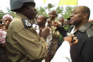 king-charles-wesley-mumbere-r-exchanges-words-with-police-officer-file-photo. He was arrested and airlifted to a yet to be identified destination.