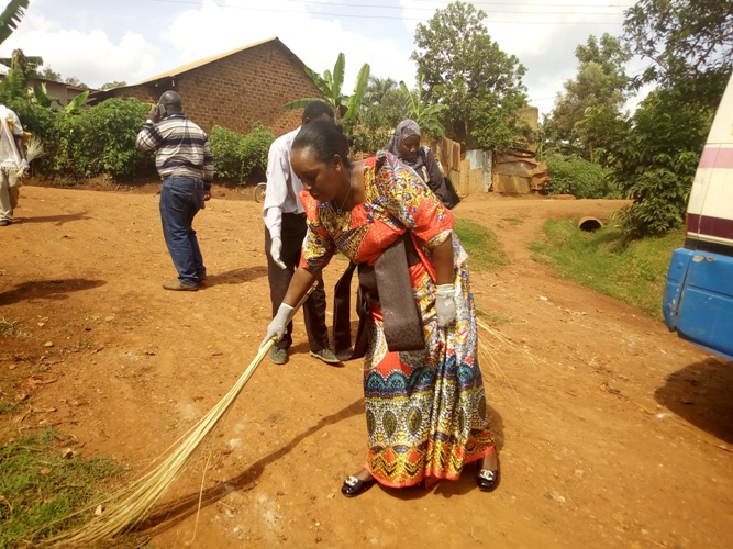 Residents Urged To Fight Poor Hygiene In Homes. mp-tumusiime-participates-in-a-cleaning-exercise