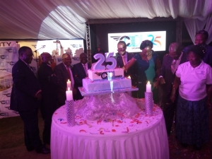 works-minister-eng-monica-ntege-tourism-minister-ephraim-kamuntu-and-caa-management-cut-a-cake-to-celebrate-caas-silver-jubilee
