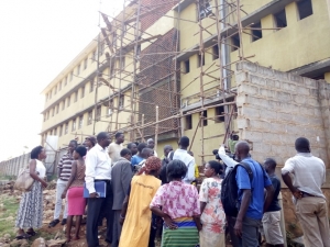 Kiwafu East residents demonstrating over the perimeter wall fence at the school premises.