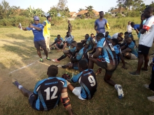 Mongers Rugby Coach Ssebalamu Kigongo talks to his players during half time. Mongers eased past Buffaloes 15-08.