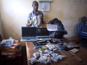 Ssebagala Mutwalibu with the stolen phones at Entebbe Police Station.
