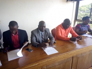 Town Clerk Charles Magumba (L), Mayor Kayanja, Stanley Namayirira and Hon. Tumusiime during the consultative meeting with the Kitooro Taxi Park Traders.