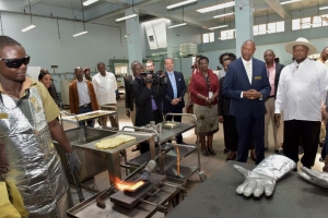 Museveni with other officials admire some of the gold refined by the African Gold refinery.