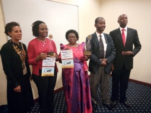 SOS' Lillian Ssengooba and Mary Goretti Katusabe pose for a photo with their awards. The function was held at Windsor Lake Victoria Hotel.