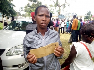 Hellen Chemutai with her Cash Envelope.