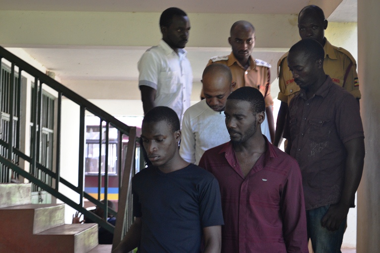 NRM LC5 Councilor, Co-Accused Convicted Over Assault. The Five convicts being escorted by prison officers to court cells