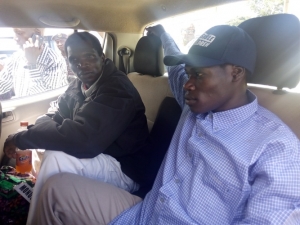Former LRA Senior commanders Simon Peter Ochora (with cap) and Bosco Kilama shortly after arriving at Entebbe Airport.