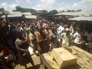 Fishermen listen to the warning and instructions during the Sensitization meeting. They were directed to hand over all their illegal fishing gear.
