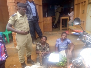 OC Mpala Joseph Sekitoleko (L) parades the thugs.