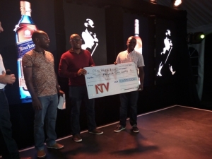Professional Captain Deo Akope receives the Shs2m dummy cheque from NTV officials.