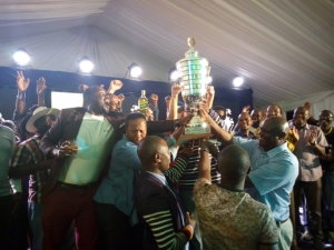 Team Uganda Golf Club celebrate at the 19th hole shortly after being crowned Champions.