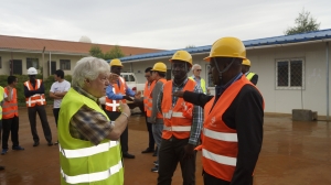 A consultant from the Dar Al-Handash Shair and Partners shares a moment with a board member during the inspection.